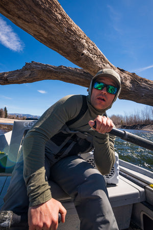 Dodging an overhanging tree on the Bitterroot River in the Thermo 150 Hoody and RS Waders from Skwala Fishing.