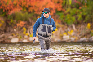 Wading through the Yellowstone River while wearing the Fusion 3/2 Puffy and RS Waders from Skwala Fishing.