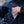 Load image into Gallery viewer, In field image of a fly box being placed into a zippered chest pocket.