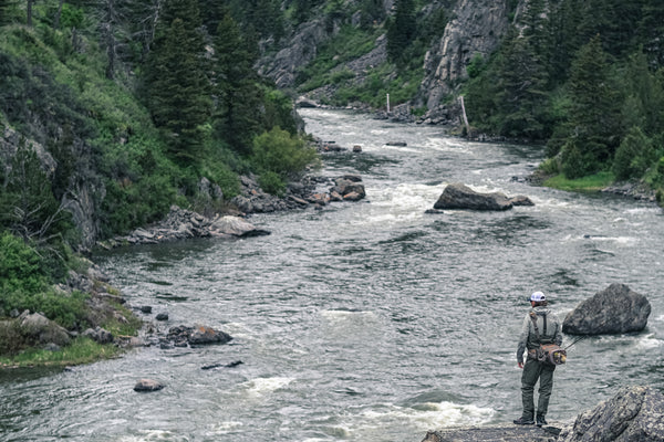 Looking down into the Madison River in the Carbon Waders and Sol Tactical Hoody. 
