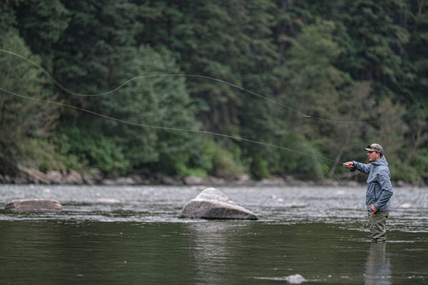 Casting in the rain while wearing the Carbon Jacket and Carbon Waders. 